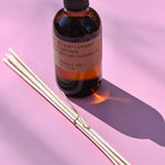 The P.F. Candle Co. Ojai Lavender - 3.5 oz Reed Diffuser on a pink background
