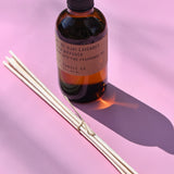 The P.F. Candle Co. Ojai Lavender - 3.5 oz Reed Diffuser on a pink background