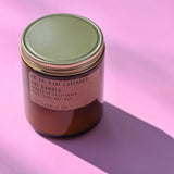 The P.F. Candle Co. Ojai Lavender - 7.2 oz Standard Soy Candle on a pink background.