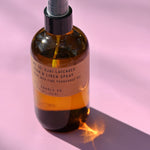 The P.F. Candle Co. - Ojai Lavender - 7.75 fl oz Room & Linen Spray on a pink background.