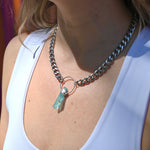 Someone wearing the Aqua Aura Athena Thick Chain Necklace.