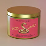 The Year of the Snake Intention & Manifestation Candle - Chinese Zodiac Candle on a pink background.