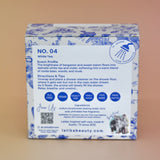 The back of the White Tea Shower Steamers - 4 Pack Shower Steamers on a pink background.