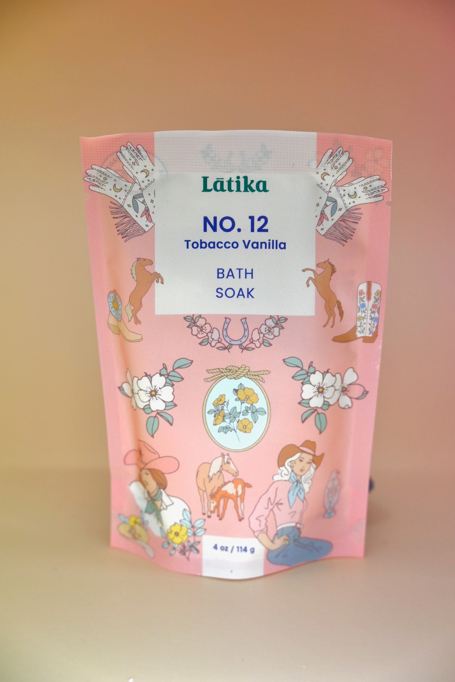 The Tobacco-Vanilla Vegan Bath Soak on a dusty pink background.