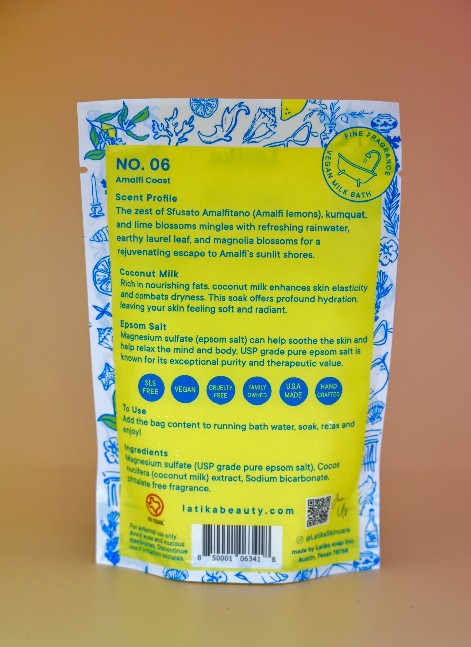 The back of the Amalfi Coast Vegan Milk Bath Soak on a dusty pink background.