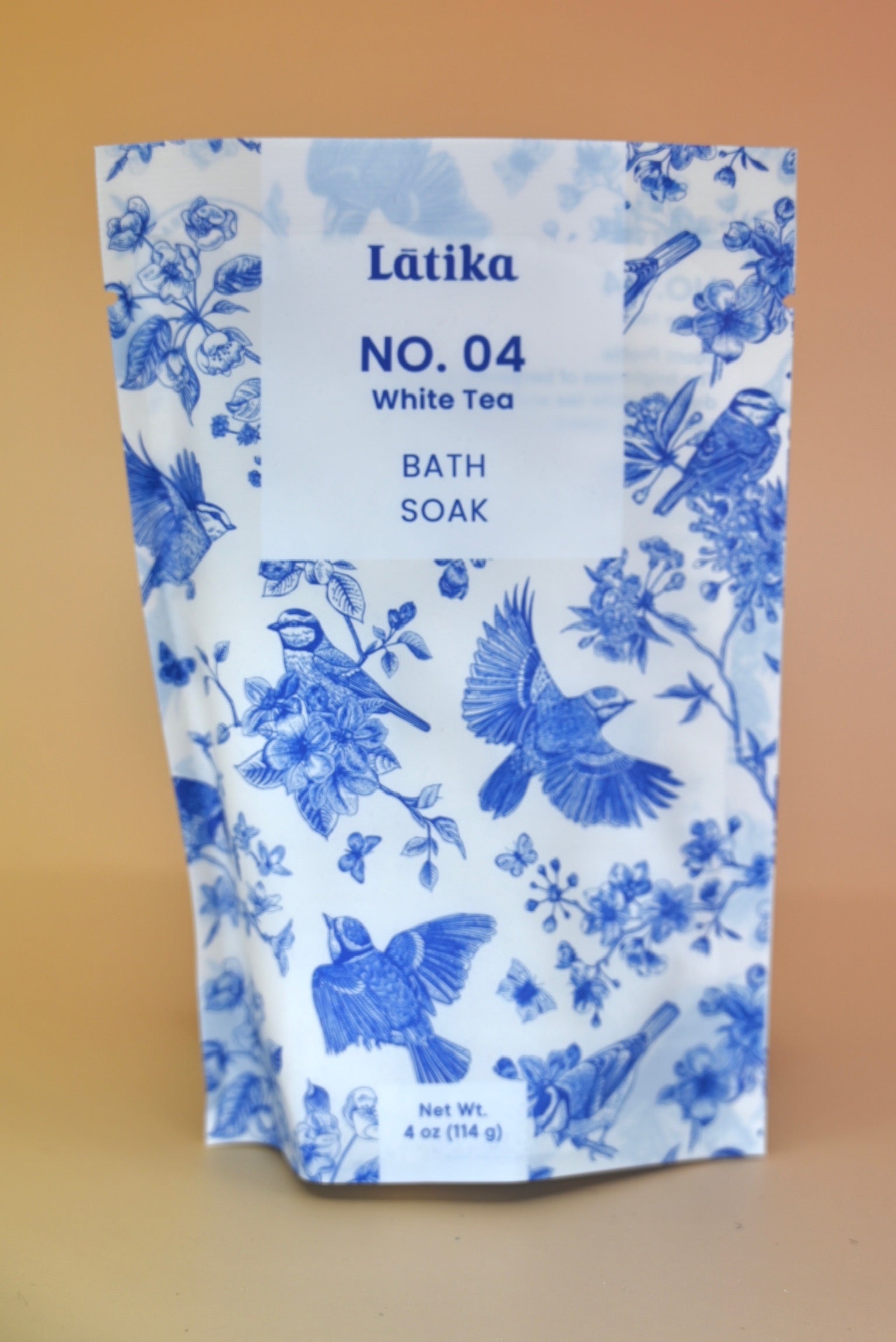 The White Tea Milk Bath Soak on a dusty pink background.