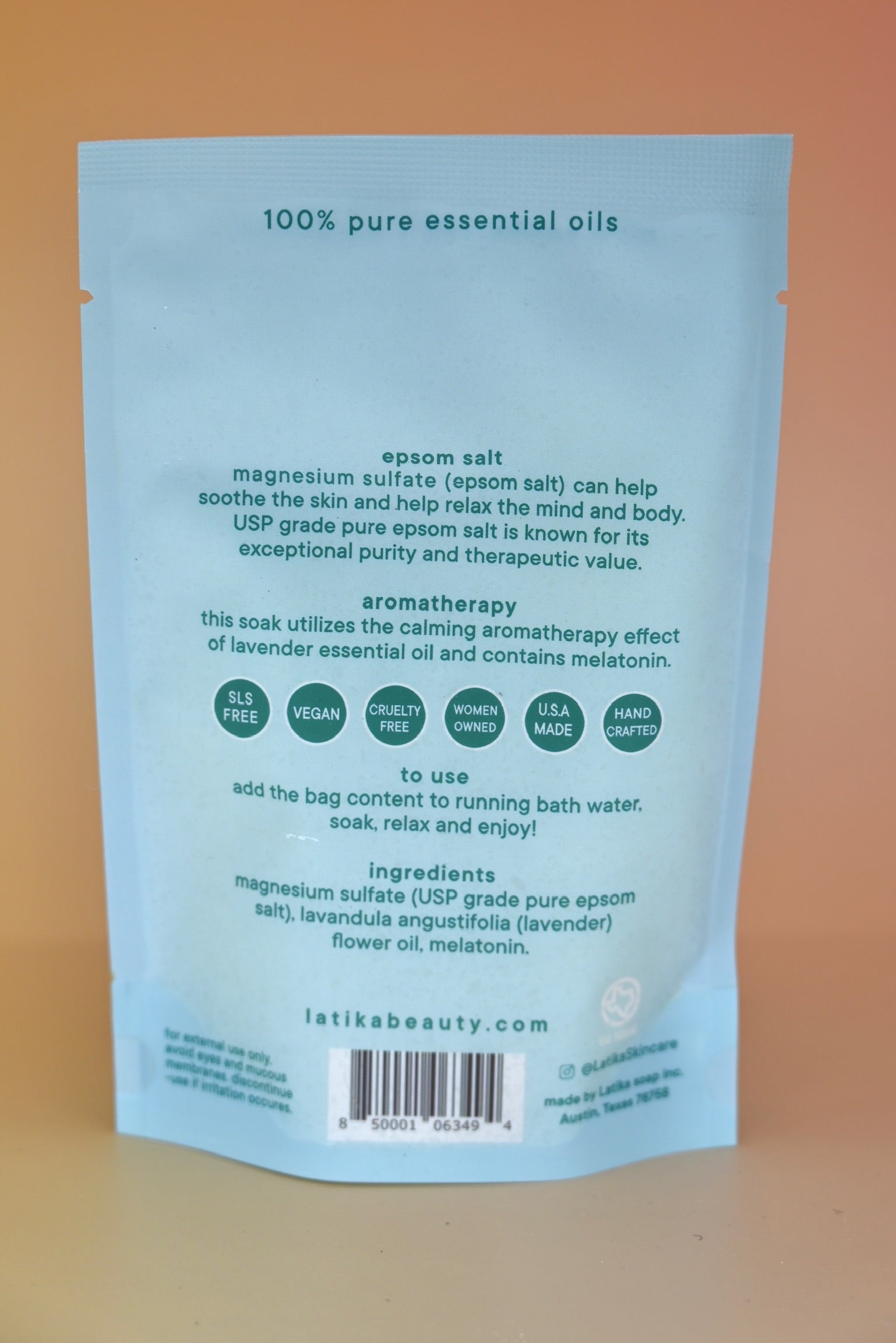 The back of the Melatonin Bath Soak for Sleep Assist on a dusty pink background.