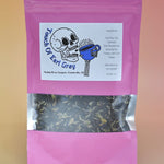 The Touch of Earl Grey Loose Tea Blend on a pink background.