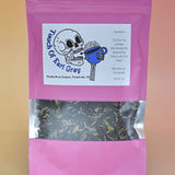 The Touch of Earl Grey Loose Tea Blend on a pink background.