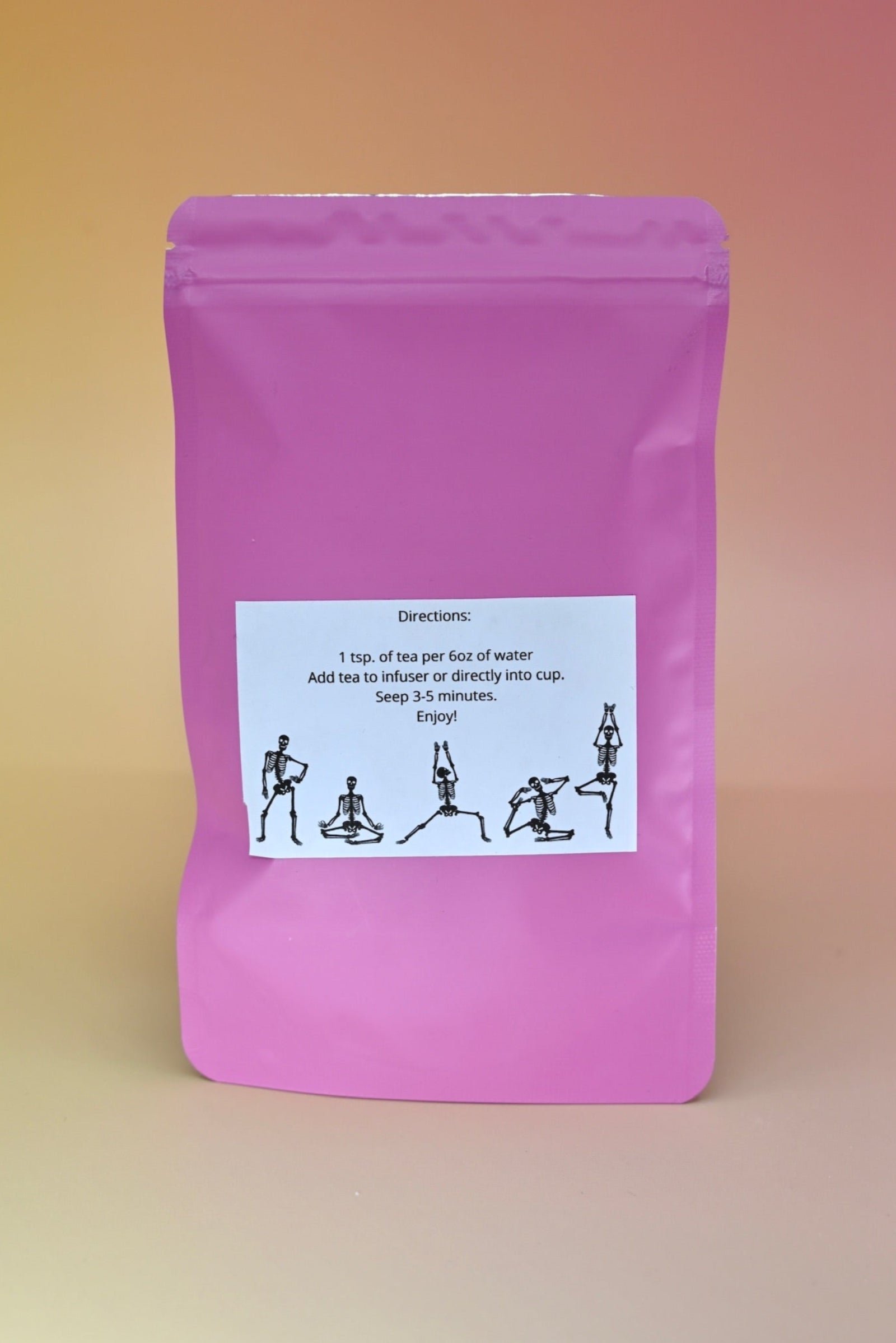 The  back of the Touch of Earl Grey Loose Tea Blend on a pink background.