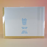 The back of the Mom Fact #46 Pregnancy Congratulations Greeting Card on a peach colored background.