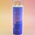 The "I am Strong" Prayer Candle on a pink and yellow background.