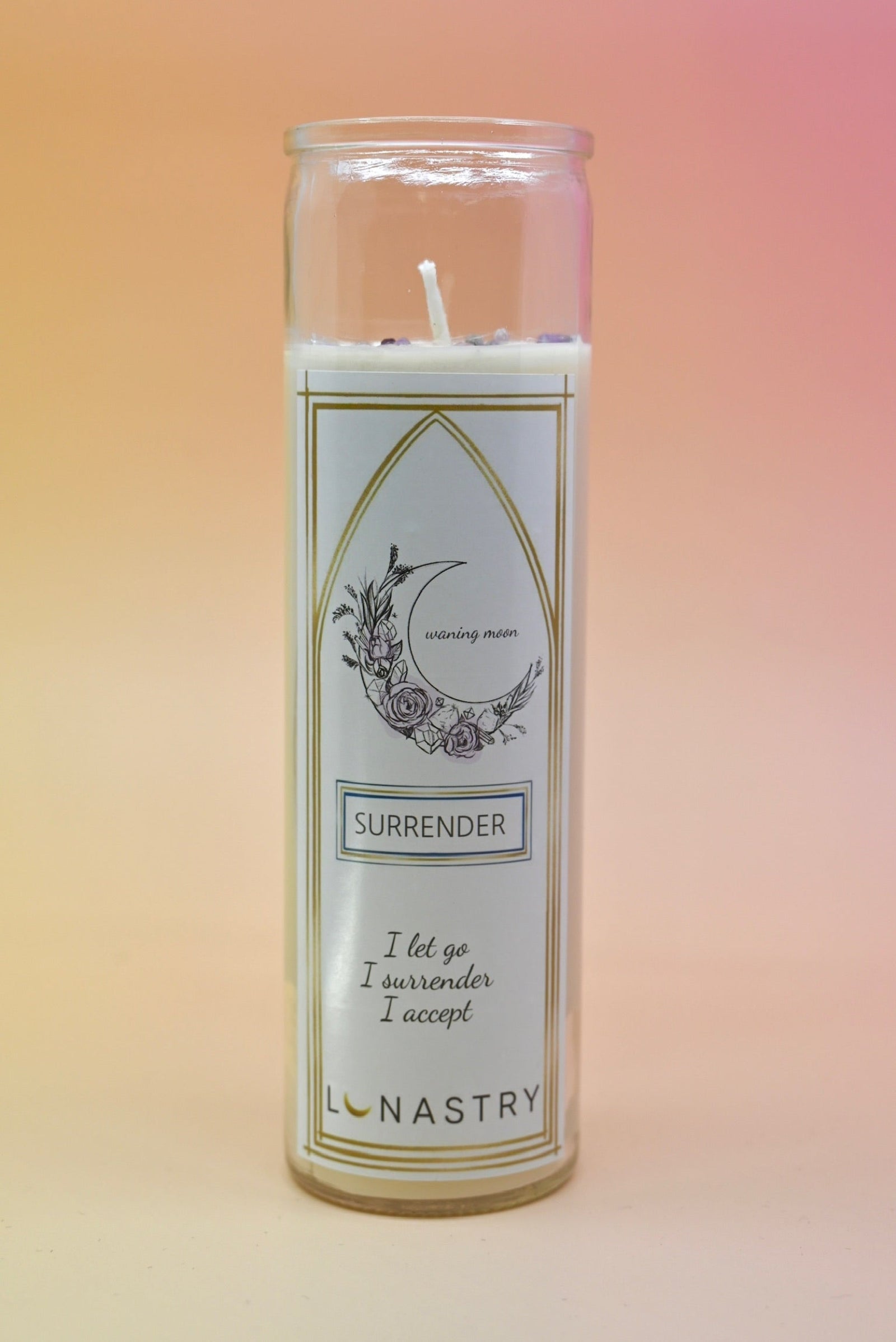 The Surrender Prayer Soy Wax Candle on a pink and yellow background.