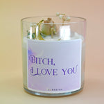 The "Bish, I love you" Candle - Floral and Crystal Candle on a peach-colored background.