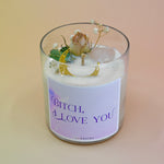 The "Bish, I love you" Candle - Floral and Crystal Candle on a peach-colored background.