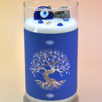 The Affirmation Evil Eye Candle - 21oz Candle on a pink background.
