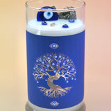 The Affirmation Evil Eye Candle - 21oz Candle on a pink background.