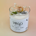 The Virgo Zodiac Crystal Candle on a peach colored background.