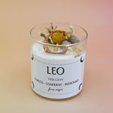 The Leo Zodiac Crystal Candle on a peach colored background.