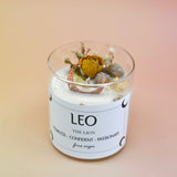 The Leo Zodiac Crystal Candle on a peach colored background.