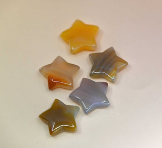 Crystal Gemstone Stars on pale orange background
