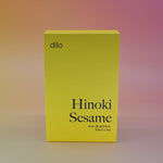 The Hinoki Sesame 50ml Unisex Eau de Parfum box on a pink background.