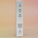 The back of the box of the Palo Santo 15ml Unisex Eau de Parfum Travel Sprayer on a light pink background.
