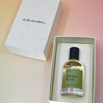 The Dilo Desert Kush 50ml Unisex Eau de Parfum in its box on a light pink background.