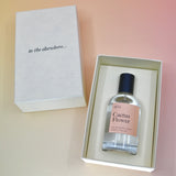 The Cactus Flower 50 ML Unisex Eau de Parfum in its box on a light pink background.