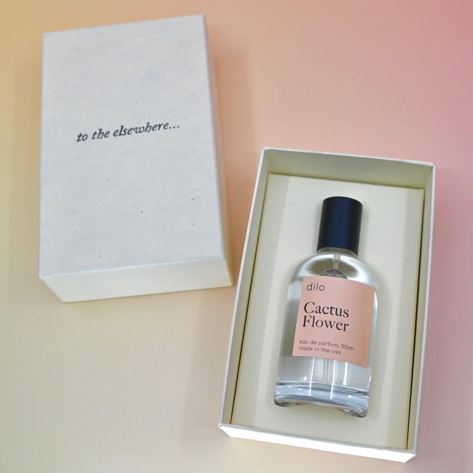 The Cactus Flower 50 ML Unisex Eau de Parfum in its box on a light pink background.