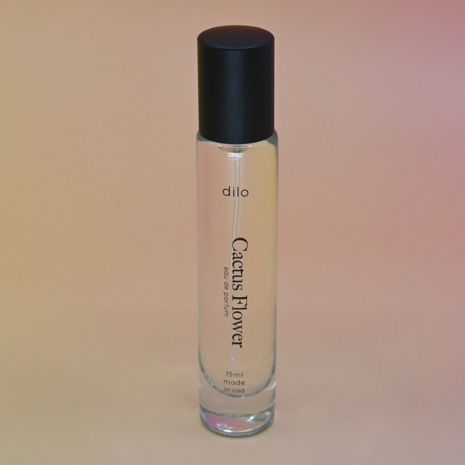 The Cactus Flower 15ml Unisex Eau de Parfum Travel Sprayer on light pink background.