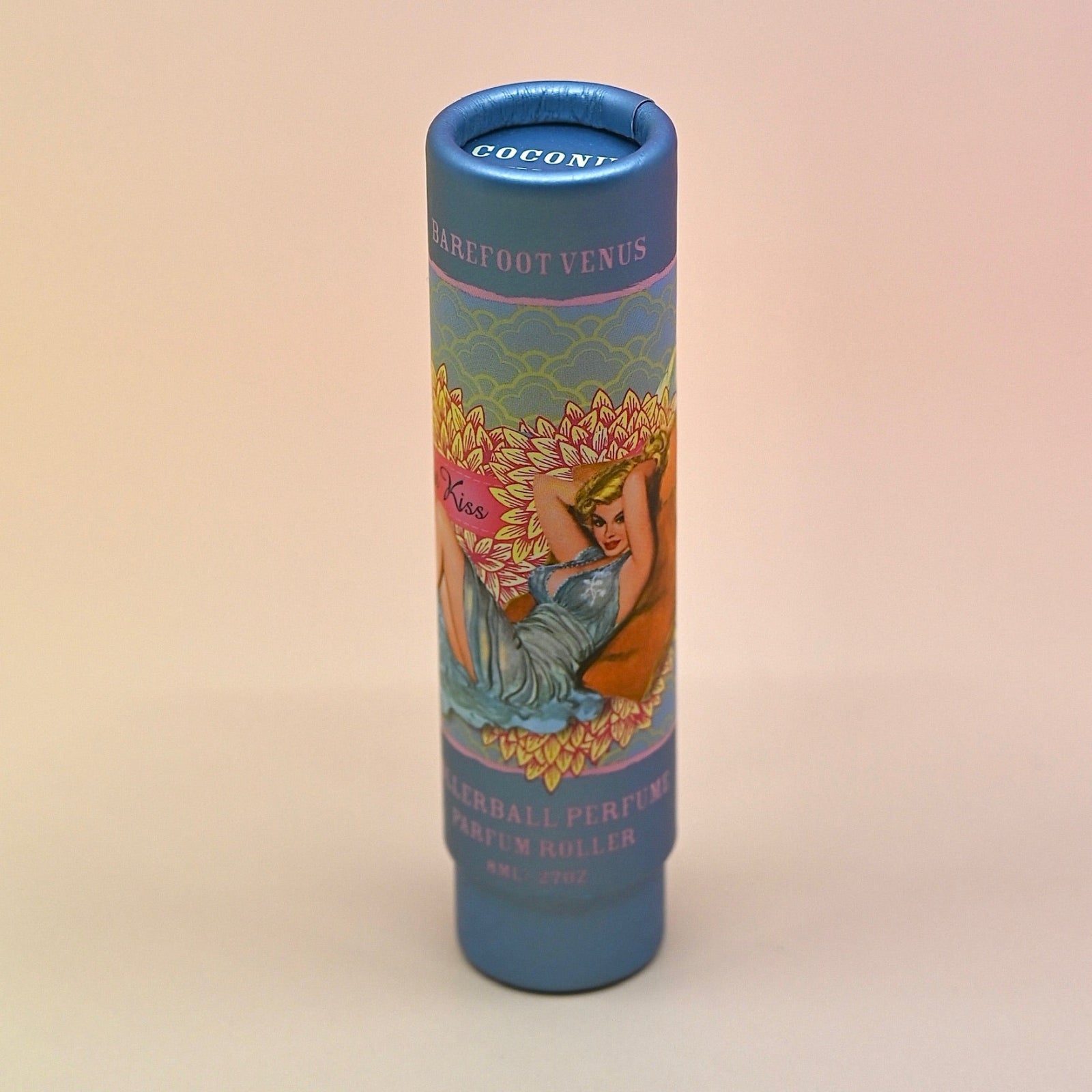 The Coconut Kiss Roll on Perfume on a light pink background.