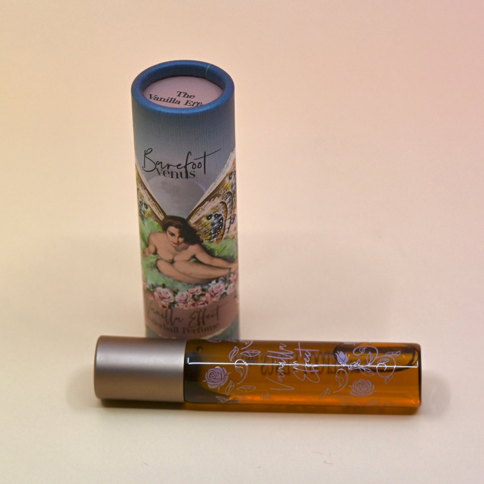 The Vanilla Effect 8ml Roll on Perfume on a light pink background.