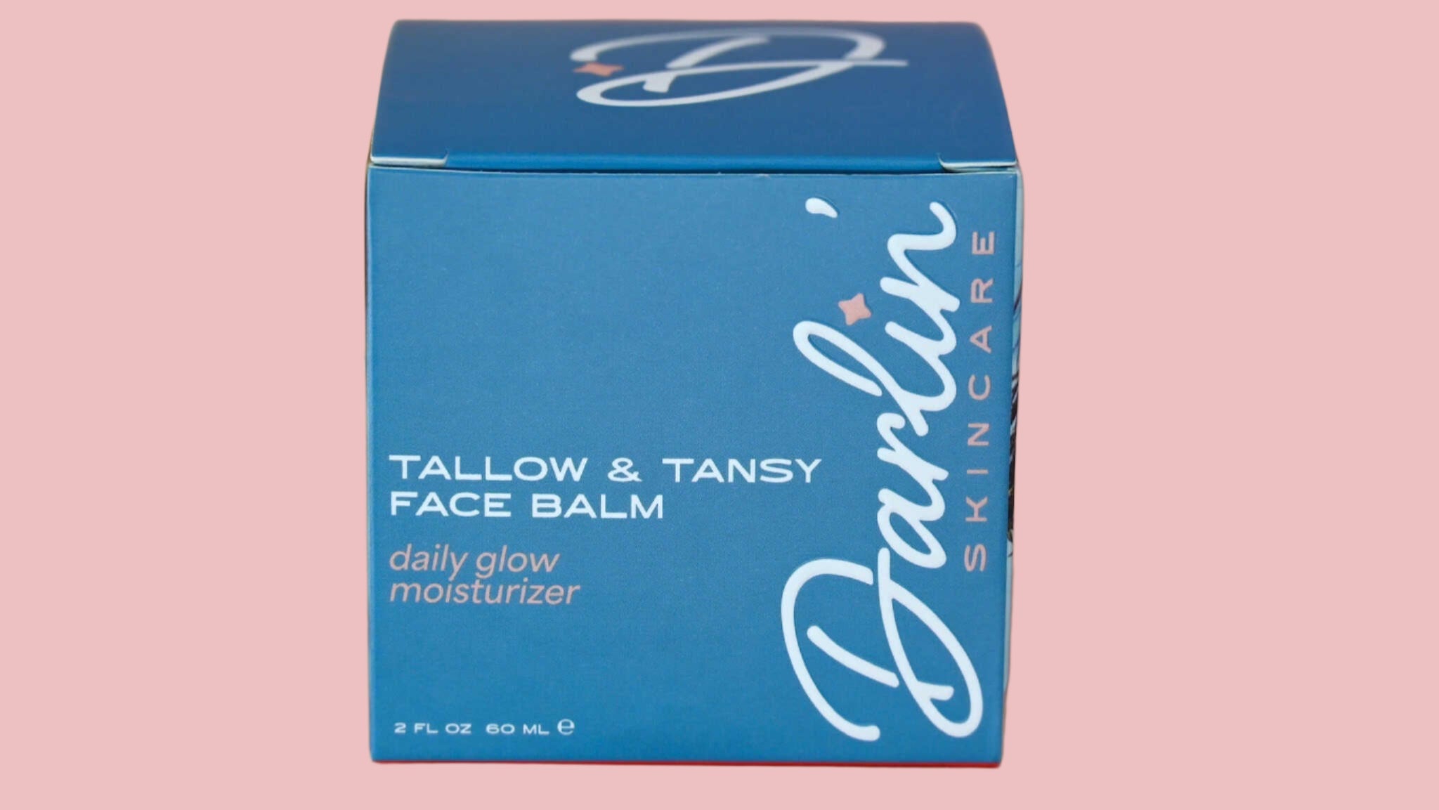 Blue box of Darlin' Skincare Tallow & Tansy Face Balm on a gradient background