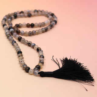 Dragon Vein Jasper 108 Mala Necklace on pink and orange background