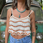 Model wearing embroidered cotton-linen crop tank top with orange stripes detail and scalloped hem