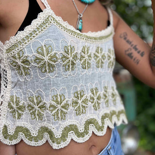 Open crochet lace front of boho crop tank top in ivory – model showing breathable fabric design with close up view of the flower pattern