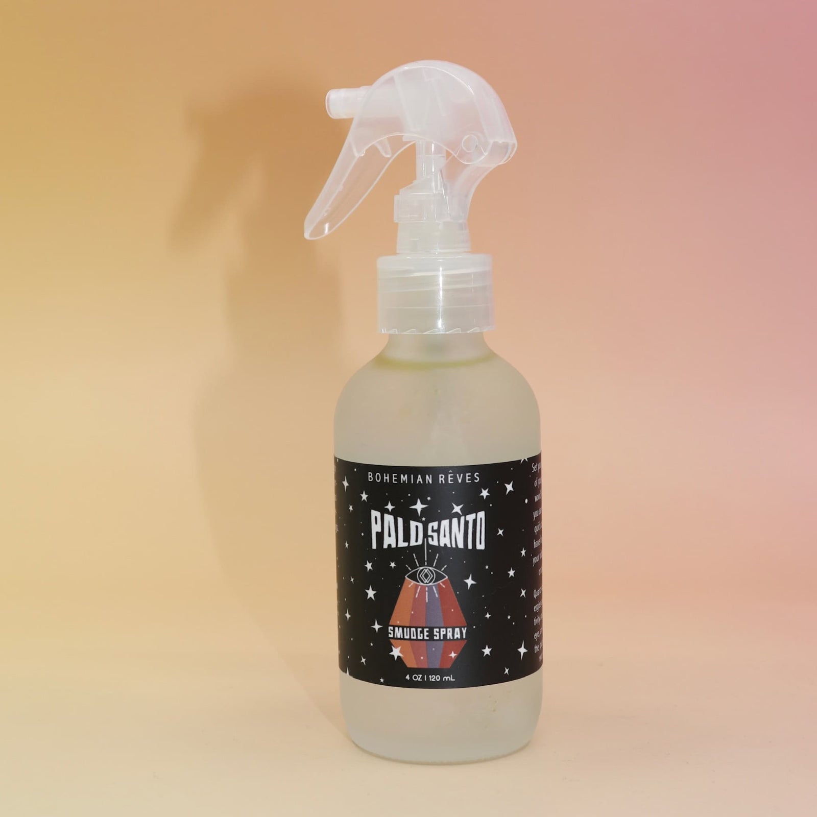 Palo Santo smoke spray bottle with a label on a gradient background