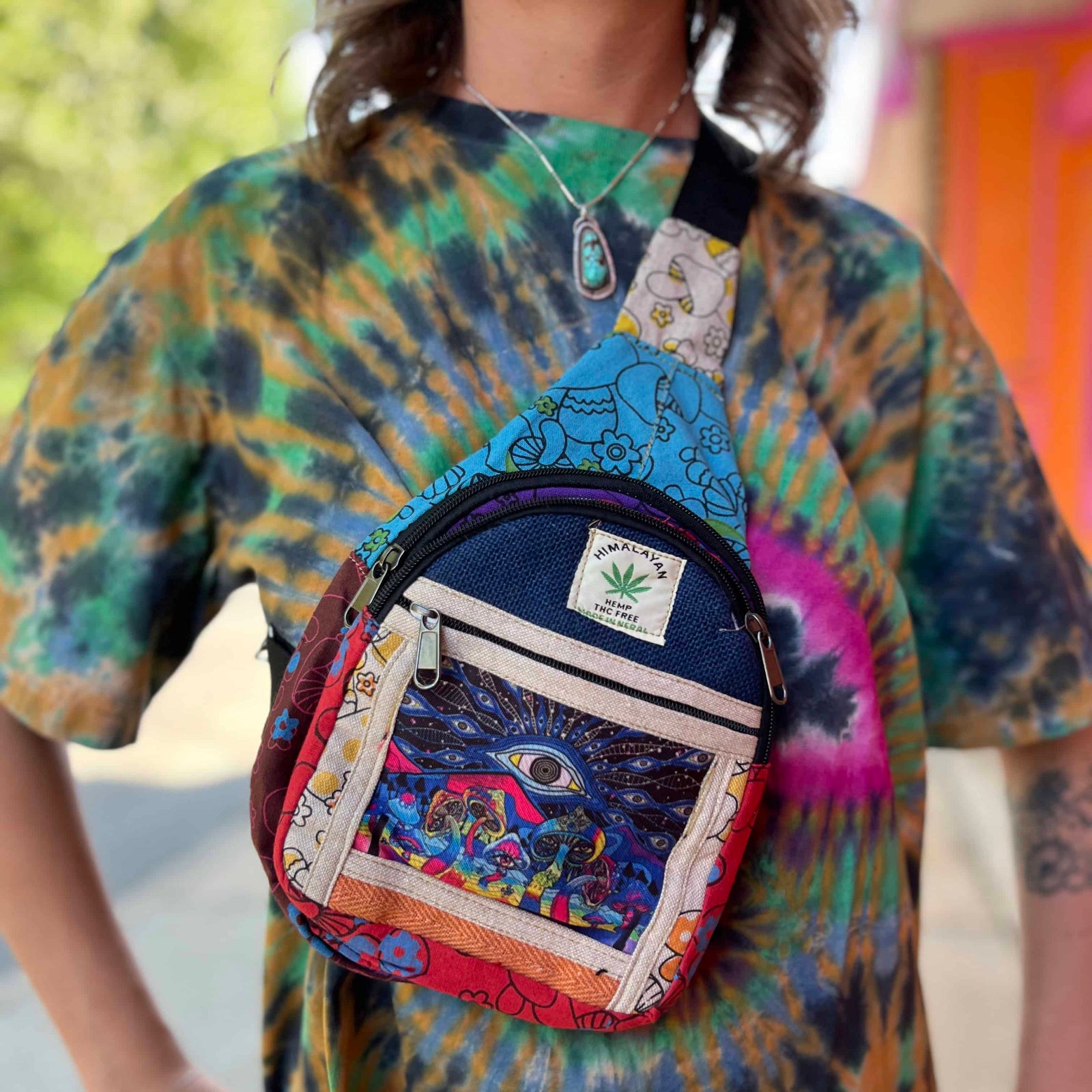 Close-up of third eye and mushroom embroidery on hemp crossbody bag