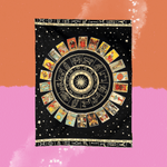 The Mystical Zodiac Wheel & Tarot Card Tapestry on a pink and orange background.