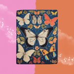 The Blue Butterfly Print Small Tapestry on a pink and orange background.
