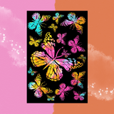 The Multicolor Tie Dye Butterfly Family Cotton Tapestry on a pink and orange background.