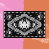 The Black & White Triple Faced Sun and Moon Cotton Tapestry on a pink and orange background.