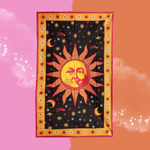 The Sleeping Sun Cotton Tapestry on a pink and orange background.