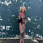 Person lying on a textured surface with peeling paint