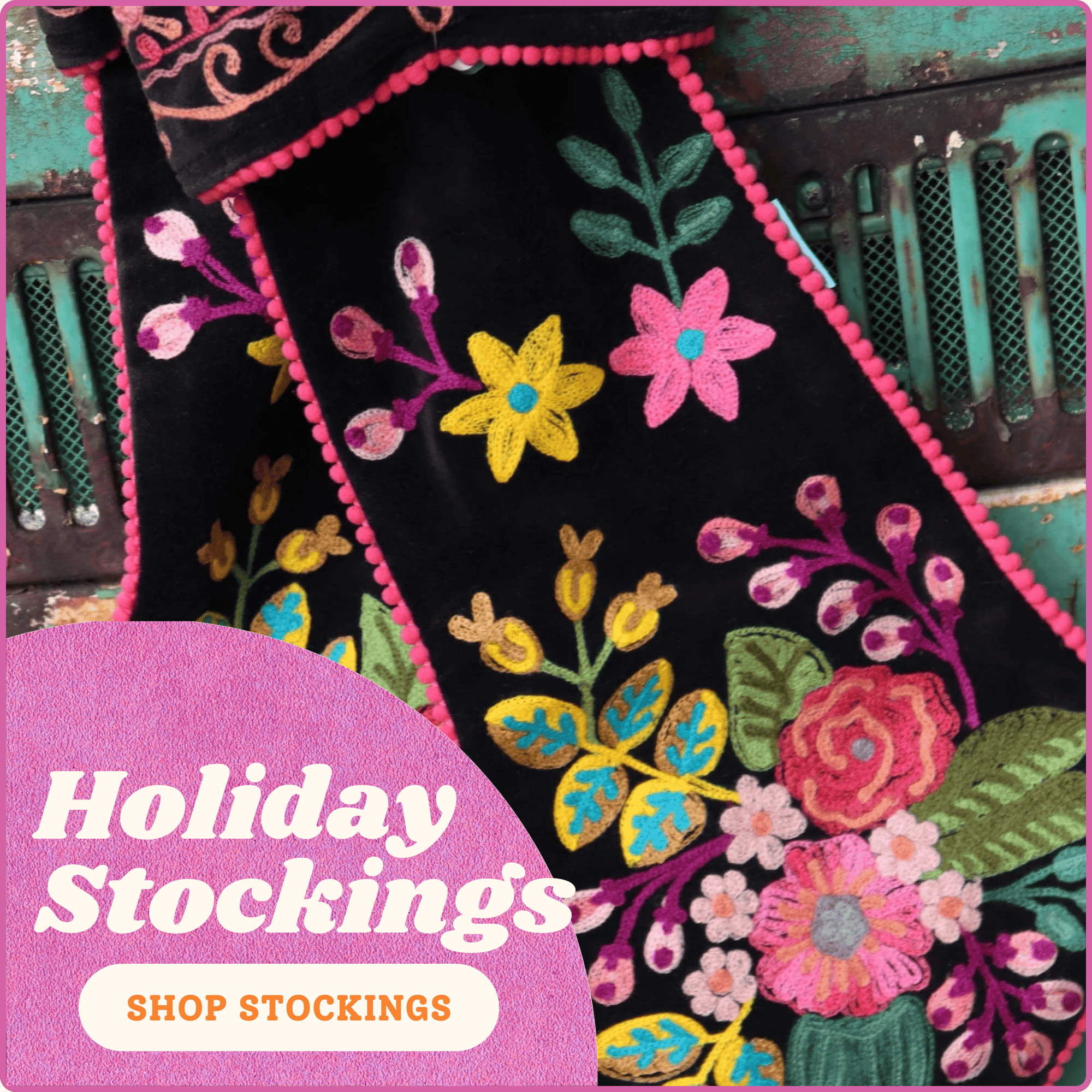 Decorative stocking with floral embroidery and text 'Holiday Stockings Shop Stockings' on a pink background.