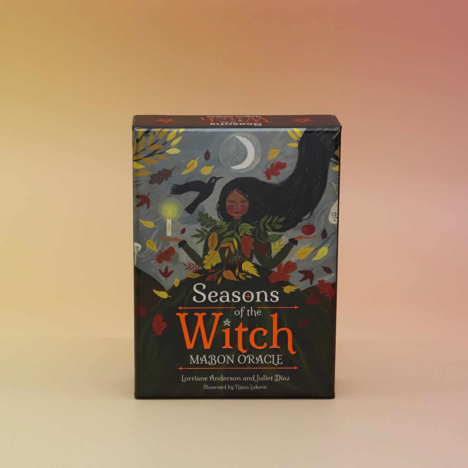 The Seasons of the Witch - Mabon Oracle Card Deck on a pink and yellow background.