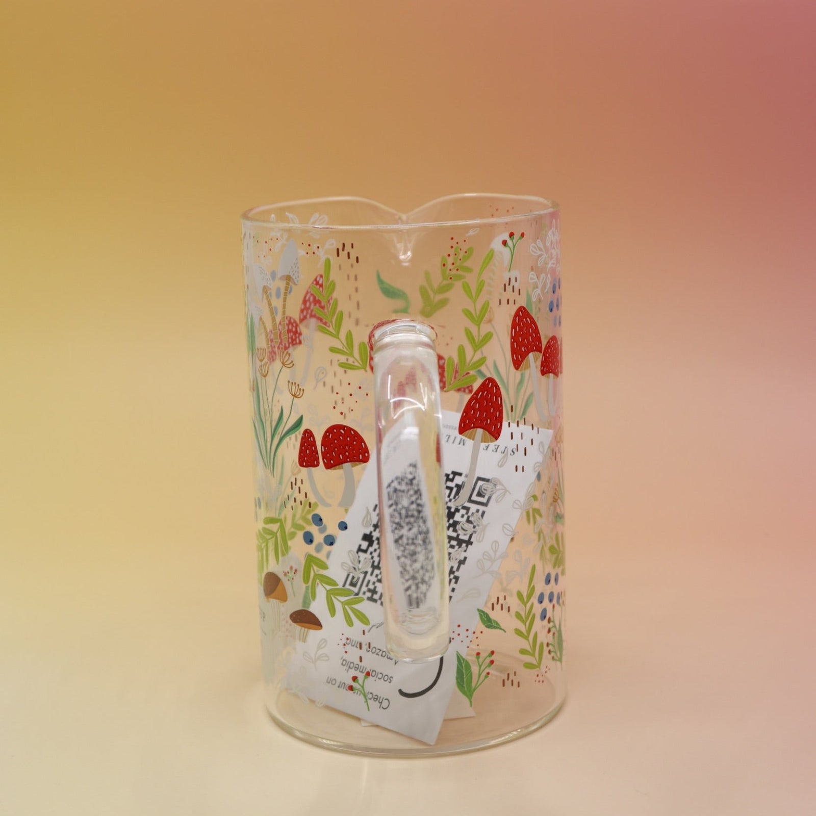 The Cottagecore Mushroom 1000 mL Measuring Cup on a pink and yellow background.