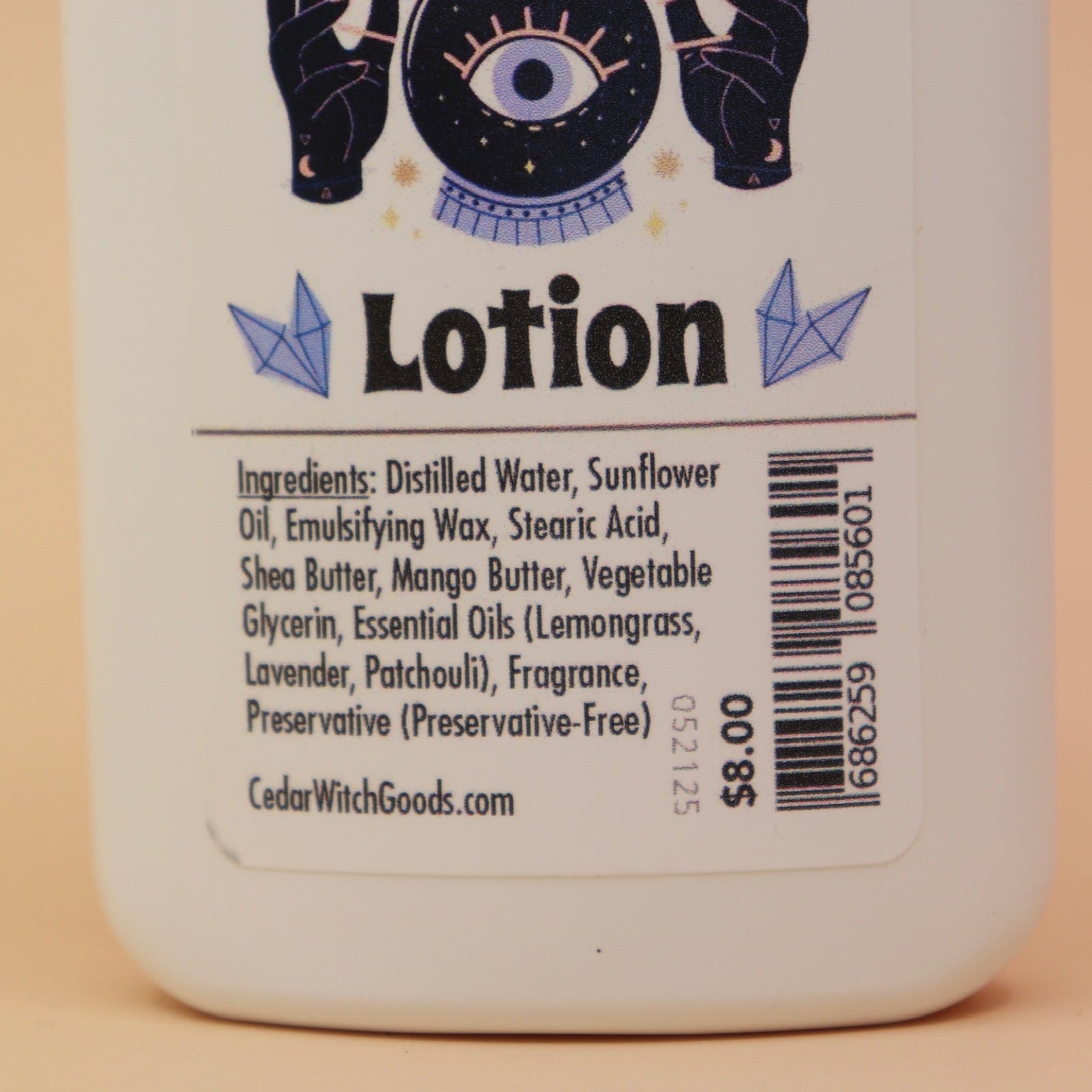 An up-close image of the Hippie Witch Body 4 oz Lotion on a pink and yellow background.