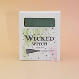 The Wicked Witch Wicked Themed 4 oz Bar Natural Soap on a pink and yellow background.